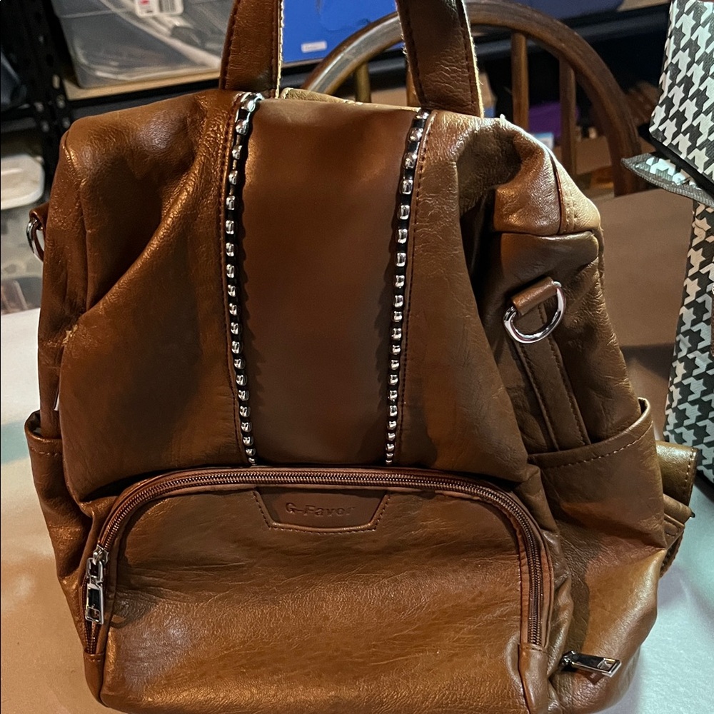 Chic Brown Backpack with Silver Accents with Small Flaw